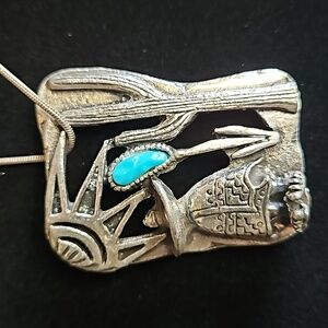 Southwestern silver necklace with turquoise colored stone